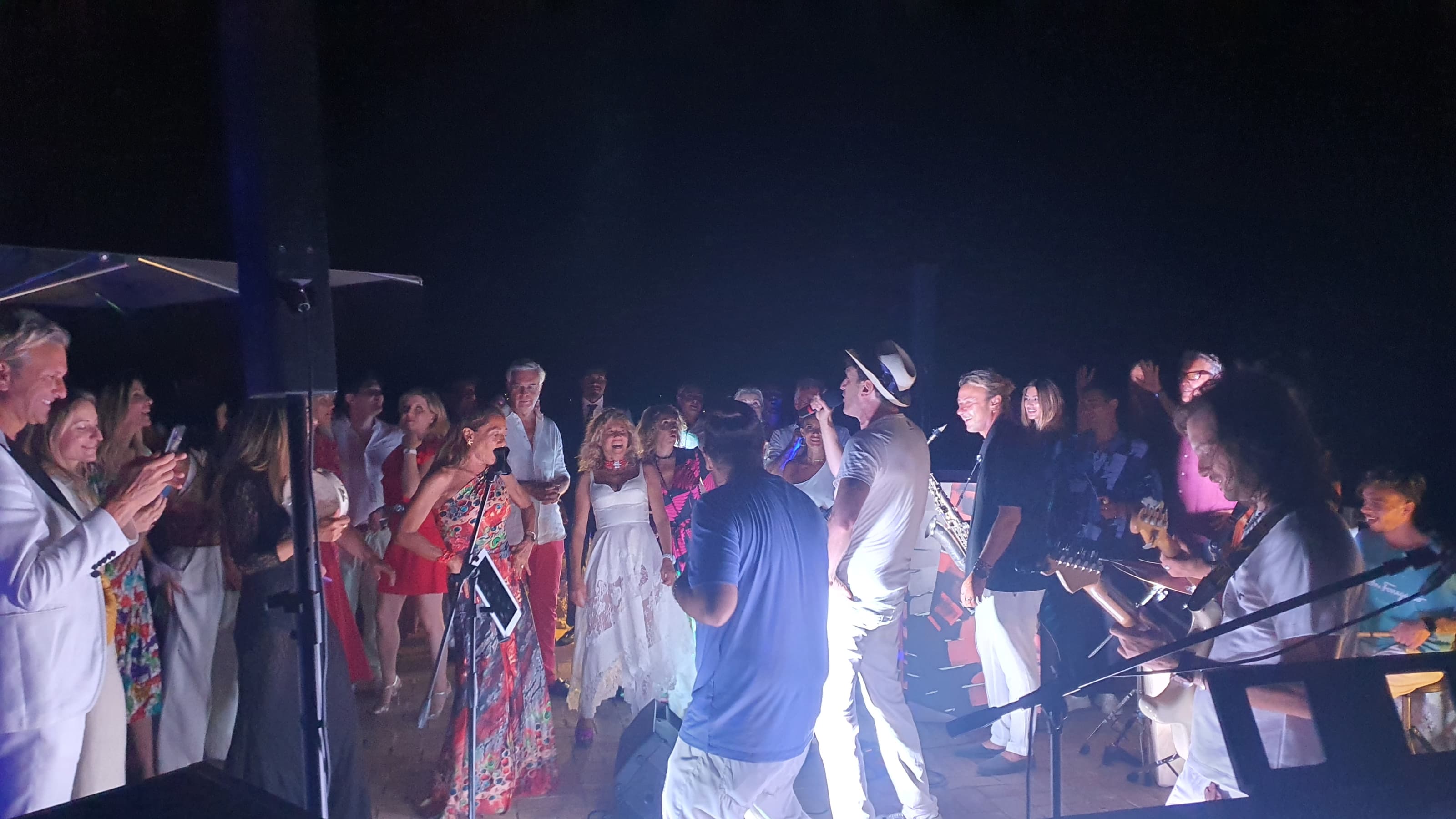 Anema e Core live band performing with crowd singing and dancing in Capri