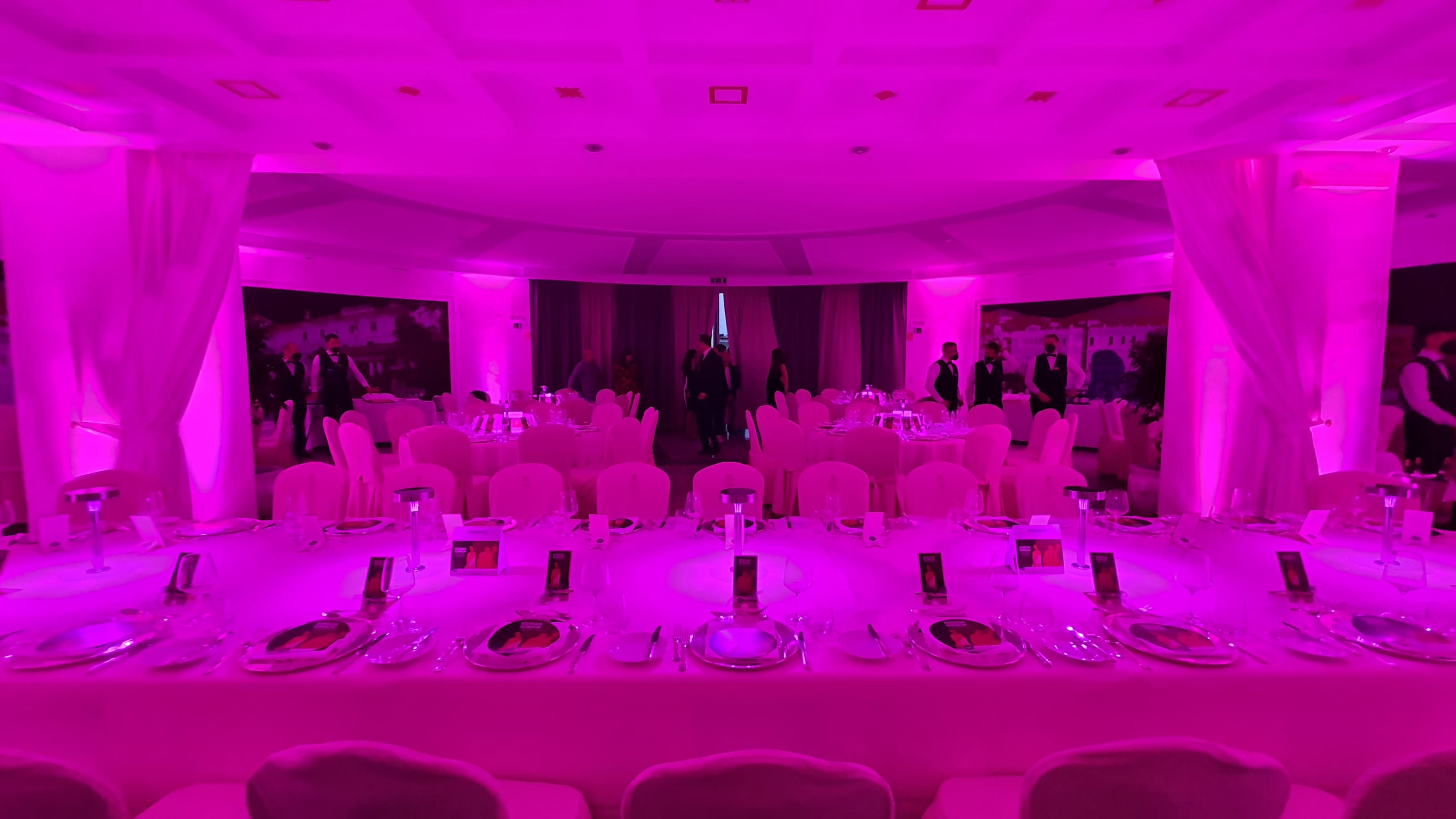 Quisisana Teatro gala night in Capri with magenta uplighting and full dinner setup