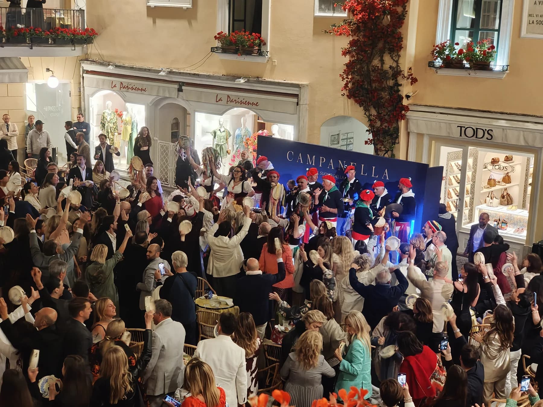 Brand evening in Capri's main square with traditional Campanella performers and crowd celebrating